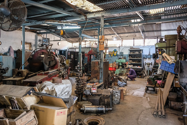 Clean, well-lit service bay at Ironclad Auto Service in Guelph, with a vehicle on the lift